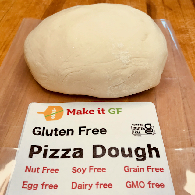 Image of gluten free pizza dough out of package and a label for the pizza dough packaging that notes it is gluten free, nut free, soy free, grain free, egg free, dairy free and gmo free